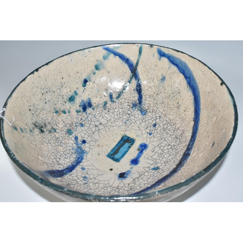 364 - CATRIONA McLEOD: A LARGE RAKU FIRED BOWL, decorated with blue and turquoise bands on a cream crackle... 