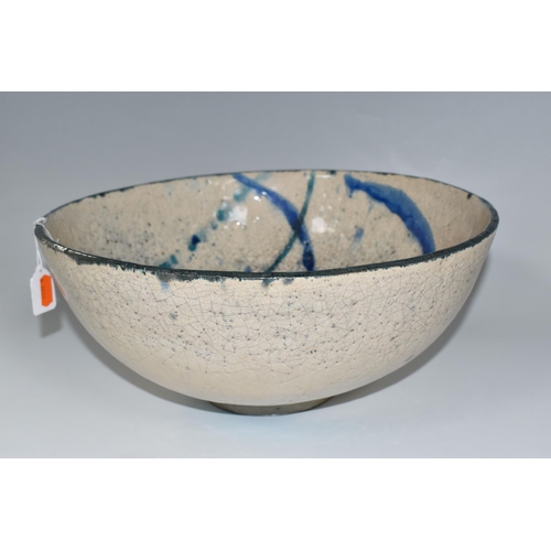 364 - CATRIONA McLEOD: A LARGE RAKU FIRED BOWL, decorated with blue and turquoise bands on a cream crackle... 