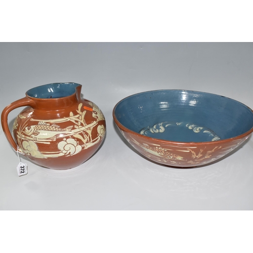 372 - A C.H BRANNAM BARUMWARE JUG AND BOWL comprising a brown sgraffito Barum bowl with glazed blue interi... 