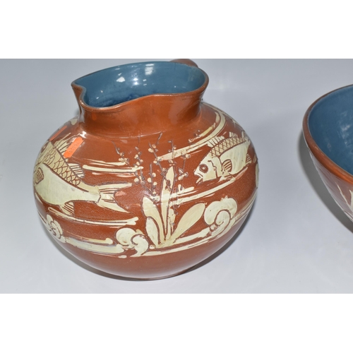 372 - A C.H BRANNAM BARUMWARE JUG AND BOWL comprising a brown sgraffito Barum bowl with glazed blue interi... 