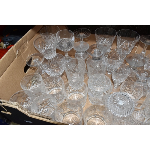 376 - A LARGE QUANTITY OF CRYSTAL CUT GLASSWARE to include two decanters, two vases, a group of bowls, a c... 