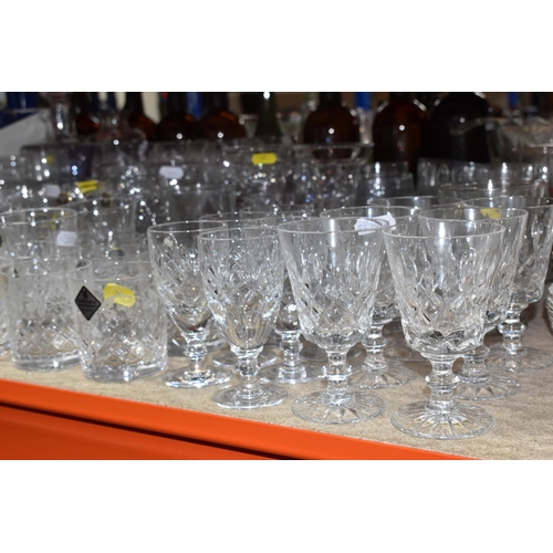 390 - A LARGE COLLECTION OF CUT GLASS ITEMS, to include a variety of crystal drinking glasses, to include ... 