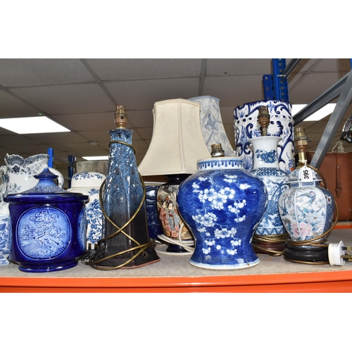 395 - A COLLECTION OF TALL ITEMS AND LAMPS, to include a small oriental blue ceramic table lamp, pattern b... 