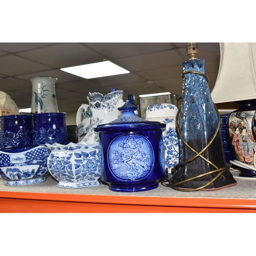 395 - A COLLECTION OF TALL ITEMS AND LAMPS, to include a small oriental blue ceramic table lamp, pattern b... 