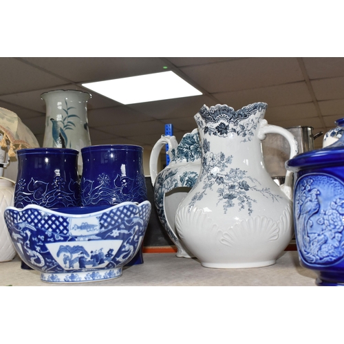 395 - A COLLECTION OF TALL ITEMS AND LAMPS, to include a small oriental blue ceramic table lamp, pattern b... 