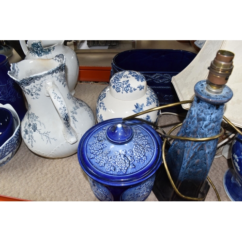 395 - A COLLECTION OF TALL ITEMS AND LAMPS, to include a small oriental blue ceramic table lamp, pattern b... 