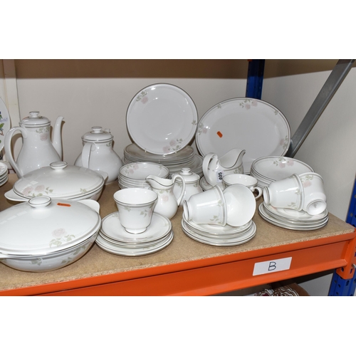 405 - A FIFTY-ONE PIECE ROYAL DOULTON 'TWILIGHT ROSE' DINNER SERVICE comprising six tea cups (one dull whe... 