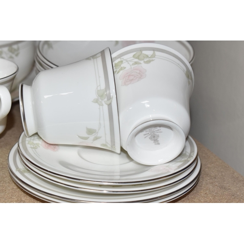 405 - A FIFTY-ONE PIECE ROYAL DOULTON 'TWILIGHT ROSE' DINNER SERVICE comprising six tea cups (one dull whe... 