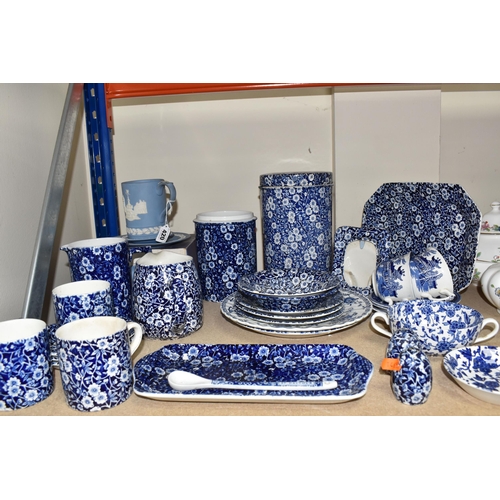 420 - A LARGE GROUP OF MOSTLY BLUE AND WHITE BURLEIGH WARES comprising two 'Willow' teacups with three sau... 