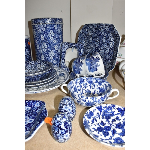 420 - A LARGE GROUP OF MOSTLY BLUE AND WHITE BURLEIGH WARES comprising two 'Willow' teacups with three sau... 