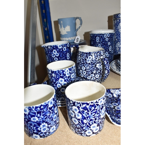 420 - A LARGE GROUP OF MOSTLY BLUE AND WHITE BURLEIGH WARES comprising two 'Willow' teacups with three sau... 