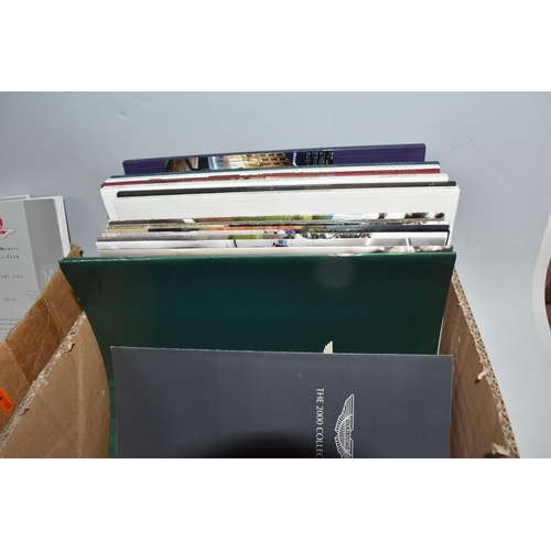 432 - TWO BOXES OF ASTON MARTIN BROCHURES, MAGAZINES, DIECAST VEHICLES AND RELATED ITEMS, to include Aston... 