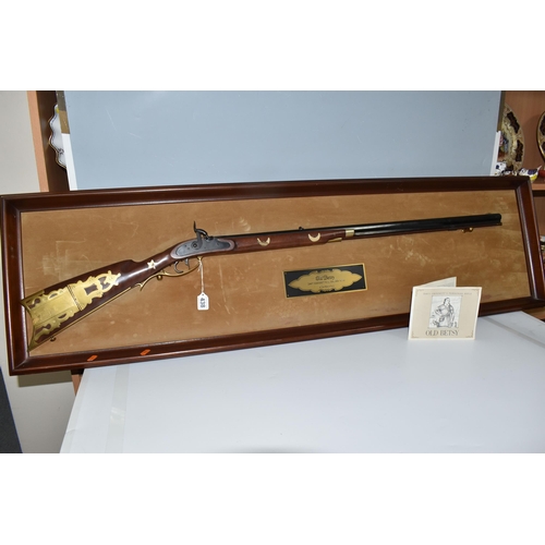 438 - A FRANKLIN MINT REPLICA 'OLD BETSY, DAVY CROCKETT'S .41 CALIBER RIFLE' on a wooden display board, wi... 