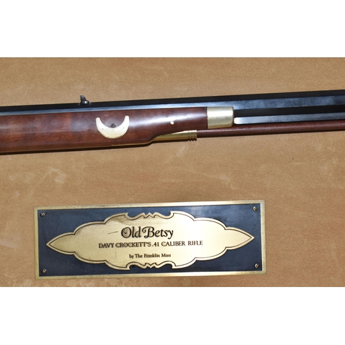 438 - A FRANKLIN MINT REPLICA 'OLD BETSY, DAVY CROCKETT'S .41 CALIBER RIFLE' on a wooden display board, wi... 