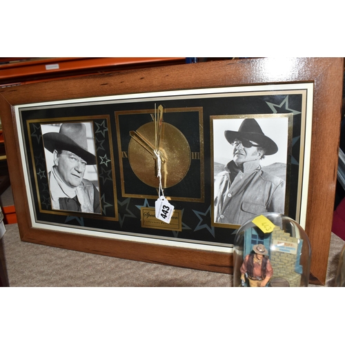 443 - A GROUP OF JOHN WAYNE RELATED COLLECTORS ITEMS to include a ten DVD boxset collection, two glass dom... 