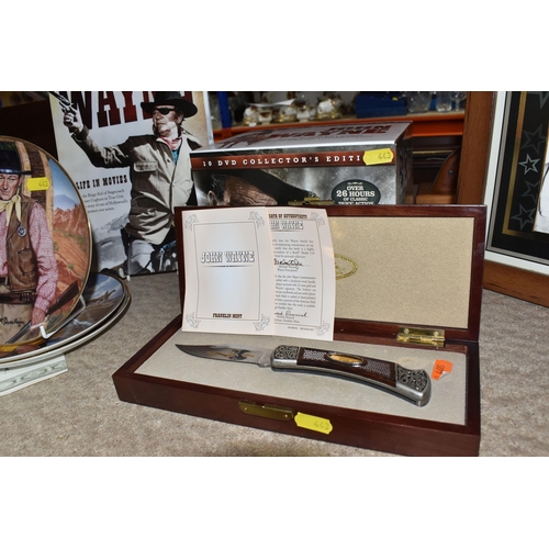 443 - A GROUP OF JOHN WAYNE RELATED COLLECTORS ITEMS to include a ten DVD boxset collection, two glass dom... 