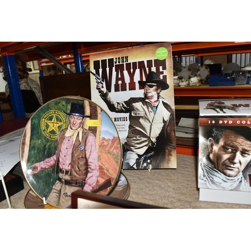 443 - A GROUP OF JOHN WAYNE RELATED COLLECTORS ITEMS to include a ten DVD boxset collection, two glass dom... 