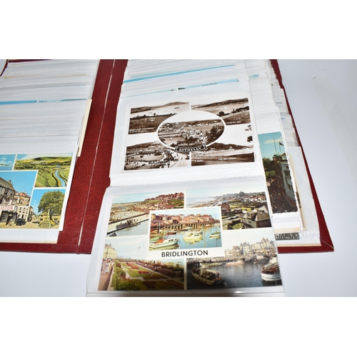 445 - TWO ALBUMS OF POSTCARDS to include one album comprising approximately two-hundred early twentieth ce... 