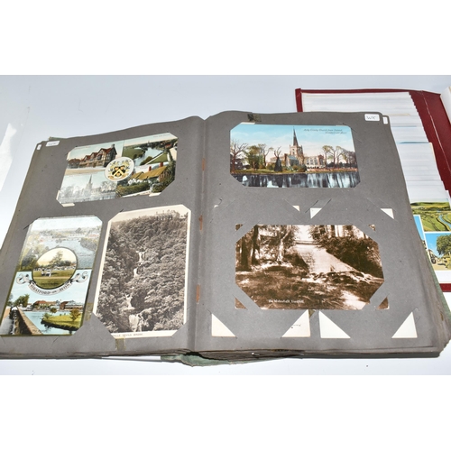 445 - TWO ALBUMS OF POSTCARDS to include one album comprising approximately two-hundred early twentieth ce... 