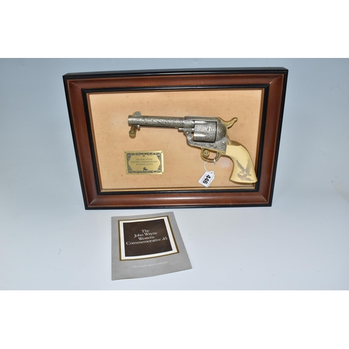 446 - A FRANKLIN MINT LIMITED REPLICA JOHN WAYNE WESTERN COMMEMORATIVE.45 on mounted frame with plaque res... 