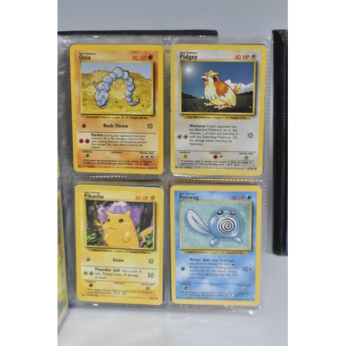 448 - TWO FOLDERS OF POKEMON CARDS, includes cards from the Base Set, Jungle, Fossil, Team Rocket and Prom... 