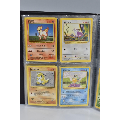 448 - TWO FOLDERS OF POKEMON CARDS, includes cards from the Base Set, Jungle, Fossil, Team Rocket and Prom... 