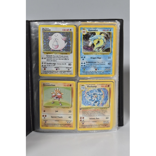 448 - TWO FOLDERS OF POKEMON CARDS, includes cards from the Base Set, Jungle, Fossil, Team Rocket and Prom... 