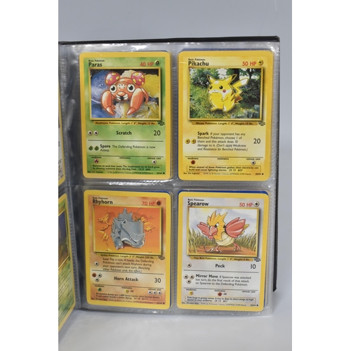 448 - TWO FOLDERS OF POKEMON CARDS, includes cards from the Base Set, Jungle, Fossil, Team Rocket and Prom... 