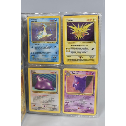 448 - TWO FOLDERS OF POKEMON CARDS, includes cards from the Base Set, Jungle, Fossil, Team Rocket and Prom... 