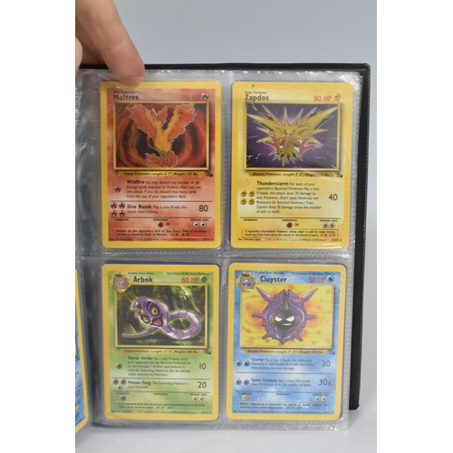 448 - TWO FOLDERS OF POKEMON CARDS, includes cards from the Base Set, Jungle, Fossil, Team Rocket and Prom... 