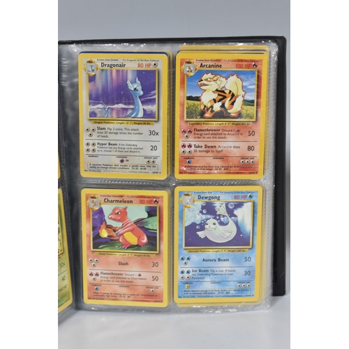 448 - TWO FOLDERS OF POKEMON CARDS, includes cards from the Base Set, Jungle, Fossil, Team Rocket and Prom... 