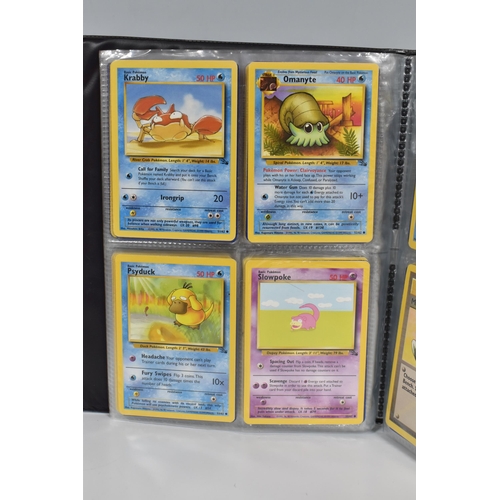 448 - TWO FOLDERS OF POKEMON CARDS, includes cards from the Base Set, Jungle, Fossil, Team Rocket and Prom... 