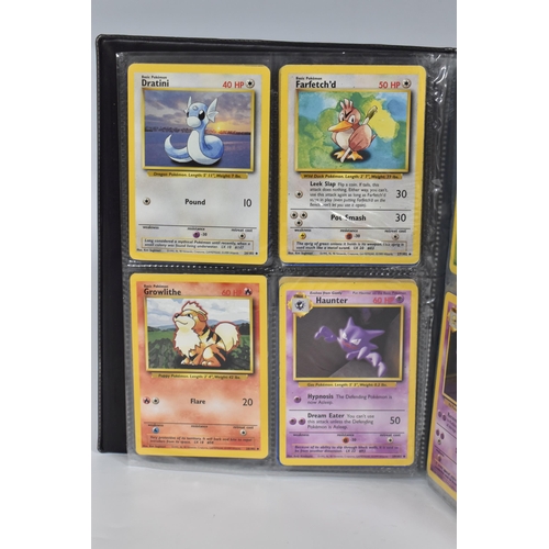 448 - TWO FOLDERS OF POKEMON CARDS, includes cards from the Base Set, Jungle, Fossil, Team Rocket and Prom... 