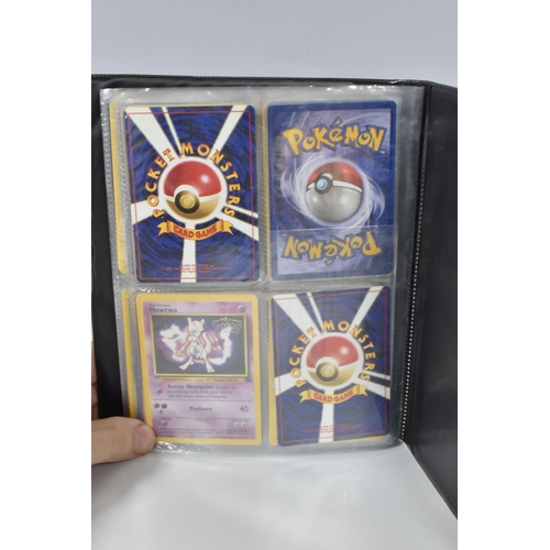 448 - TWO FOLDERS OF POKEMON CARDS, includes cards from the Base Set, Jungle, Fossil, Team Rocket and Prom... 