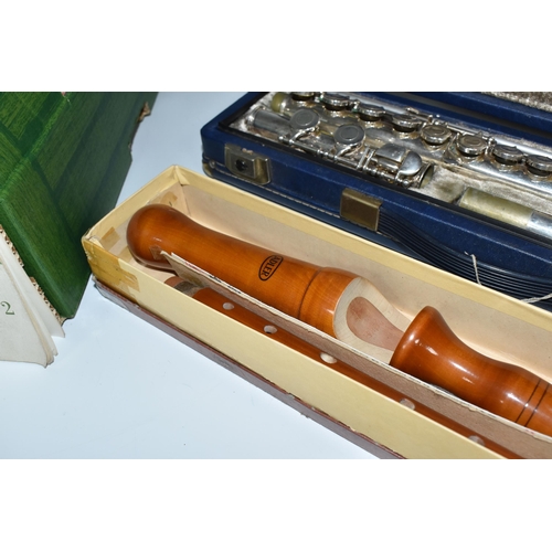 452 - A BOX AND LOOSE WIND INSTRUMENTS AND SHEET MUSIC to include a cased Boosey and Hawkes 'Emperor' flut... 