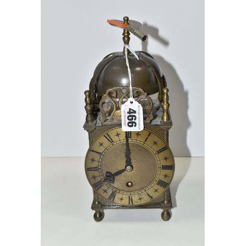 466 - A SMITHS EIGHT DAY LANTERN CLOCK, with brass case decorated with pierced and engraved dolphin/fish m... 