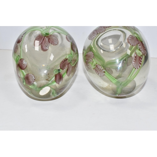 468 - A PAIR OF ART GLASS VASES, of ovoid form, decorated with pink and white orchid style flowers, on tra... 