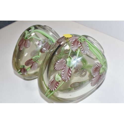 468 - A PAIR OF ART GLASS VASES, of ovoid form, decorated with pink and white orchid style flowers, on tra... 