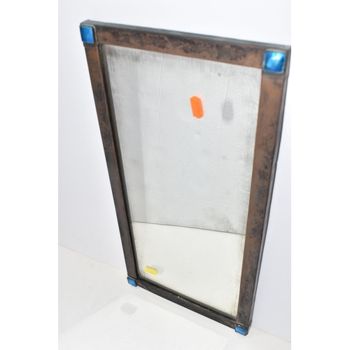 476 - AN ARTS AND CRAFTS COPPER FRAMED WALL MIRROR AND A RUSKIN POTTERY BOWL, the wall mirror with blue en... 