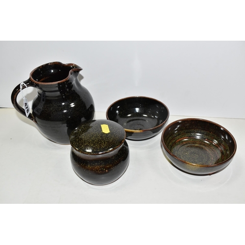 478 - FOUR PIECES OF WINCHCOMBE POTTERY, comprising a jug, height 15.5cm, two bowls and a covered sugar bo... 