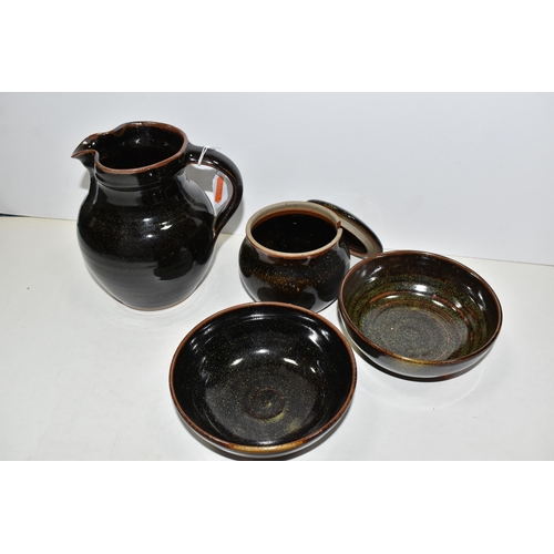 478 - FOUR PIECES OF WINCHCOMBE POTTERY, comprising a jug, height 15.5cm, two bowls and a covered sugar bo... 