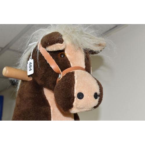 484 - A VINTAGE MAMAS AND PAPAS ROCKING HORSE, a Mamas and Papas child's plush rocking horse with a tan sa... 