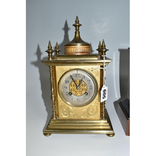 509 - THREE MANTEL CLOCKS, comprising a gilt cased mantel clock of architectural form, the case with folia... 