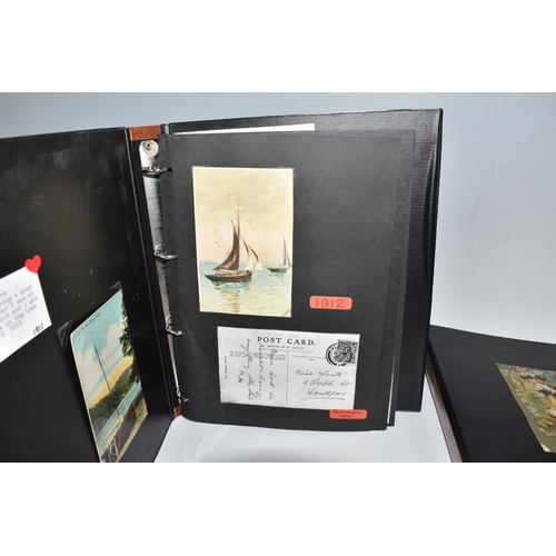 512 - FOUR ALBUMS OF POSTCARDS containing approximately 180 miscellaneous Postcards dating from the early ... 