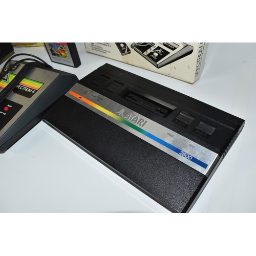 514 - THREE VIDEO GAME SYSTEMS BOXED, includes an Atari 2600 (with Centipede and a controller), Spectrum 6... 