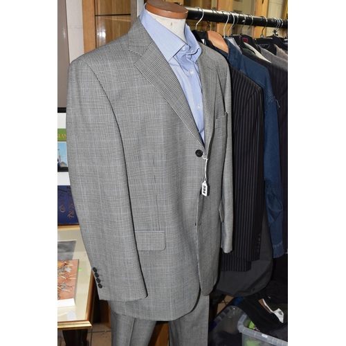 594 - A GROUP OF GENTLEMEN'S CLOTHING, sixteen items comprising an unused M&S 'Slim Fit' black suit, UK si... 