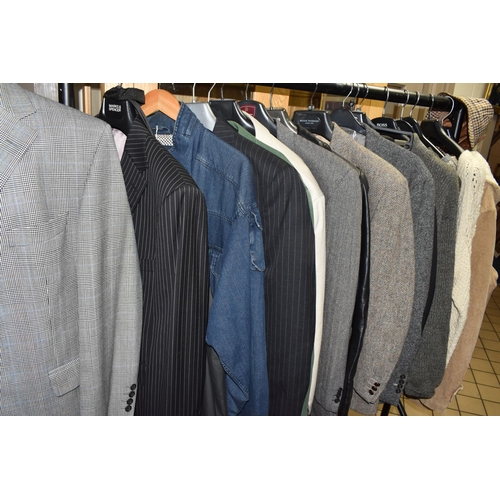 594 - A GROUP OF GENTLEMEN'S CLOTHING, sixteen items comprising an unused M&S 'Slim Fit' black suit, UK si... 