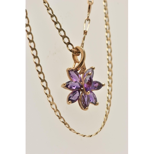 31 - A 9CT GOLD GEM SET PENDANT AND CHAIN, a floral designed pendant set with eight marquise cut amethyst... 