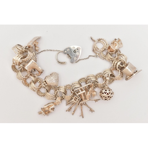 50 - A SILVER CHARM BRACELET, triple textured circular links, fitted with a heart padlock clasp, hallmark... 