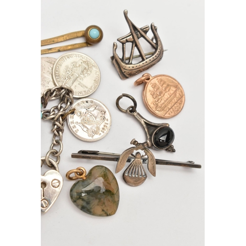 59 - A SMALL BAG OF ASSORTED ITEMS, to include a white metal Viking ship brooch stamped 'Silver' fitted w... 